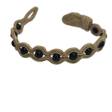 Black Onyx wrapped in golden embroidery