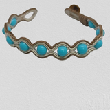 Turquoise Paste wrapped in delicate golden embroidery