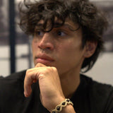 Black Onyx wrapped in golden embroidery