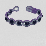 Black Onyx wrapped in purple embroidery