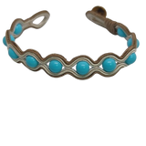 Turquoise Paste wrapped in delicate golden embroidery