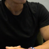 Black Onyx wrapped in purple embroidery