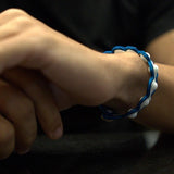 White Agate wrapped in blue embroidery